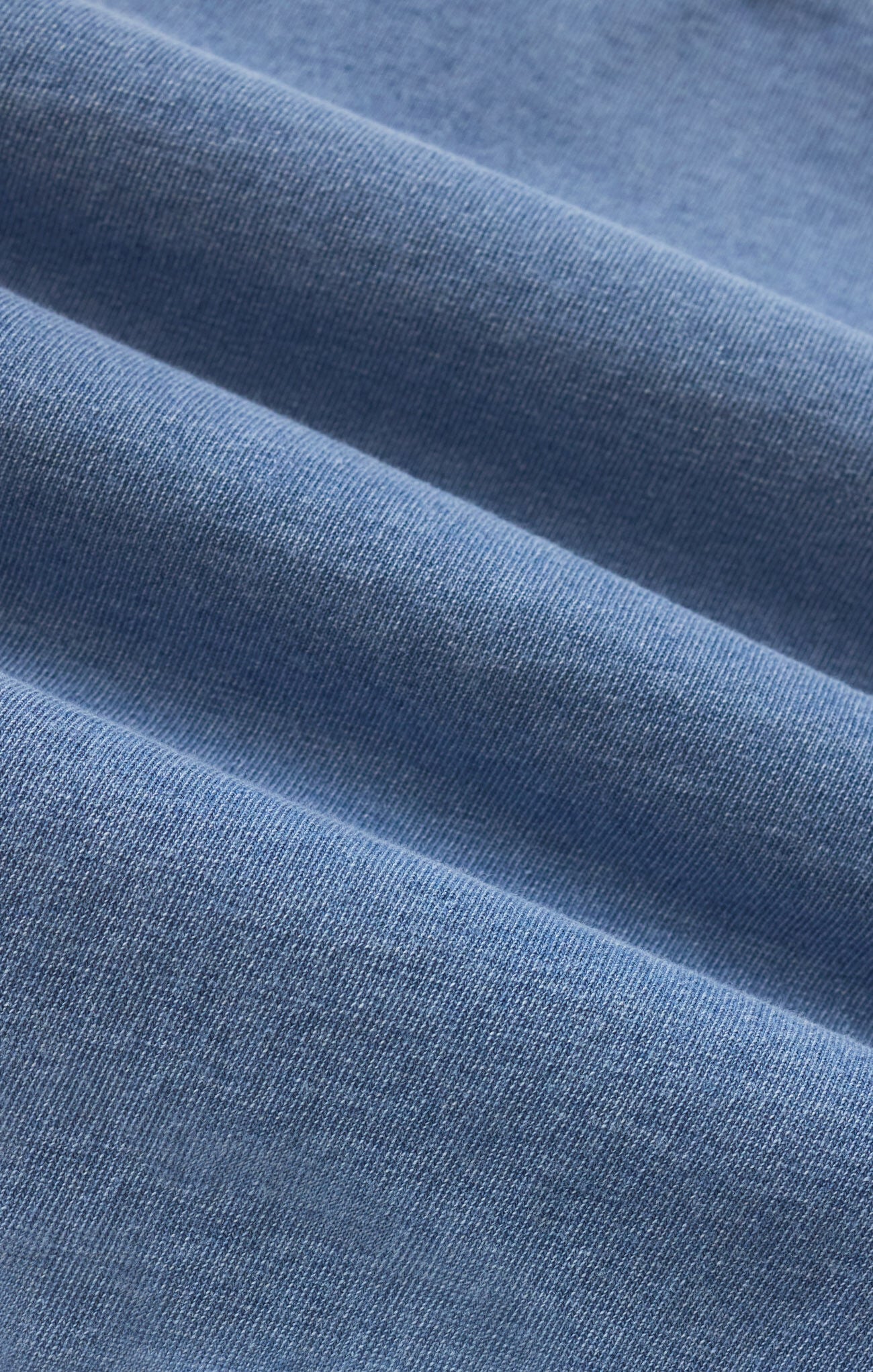 Close-up of blue fabric with a soft texture