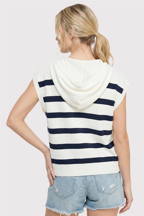 Woman wearing a striped sleeveless hoodie and denim shorts on a white background