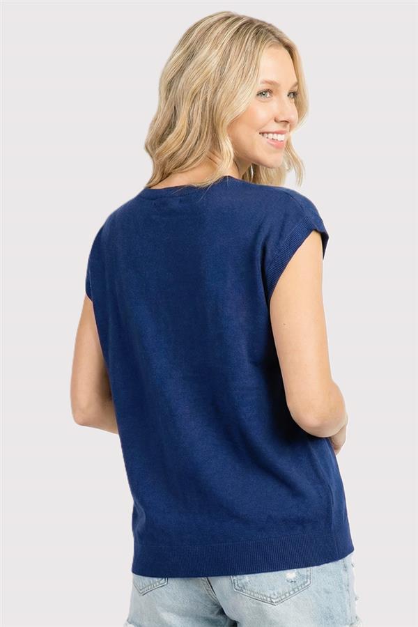 Woman wearing a blue sleeveless top on a white background