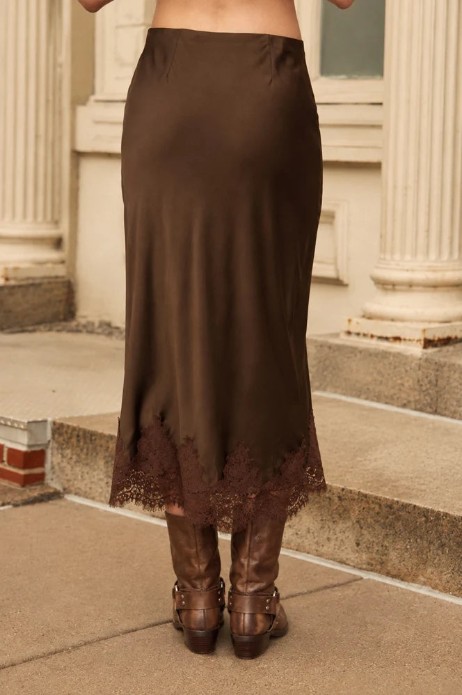 Apricot Lane Duluth Juliette brown satin pencil skirt with delicate lace hem detail, worn with brown leather boots.