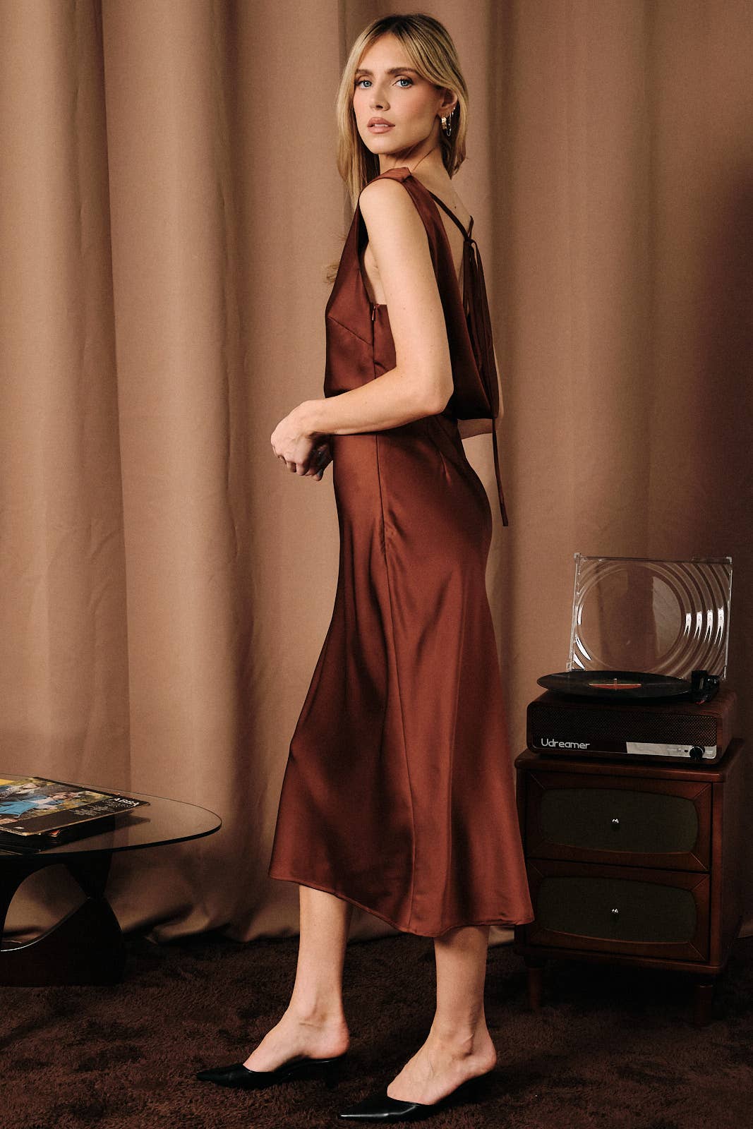 Apricot Lane Duluth chocolate brown satin midi slip dress with cowl neck and open back lace-up detail on a model