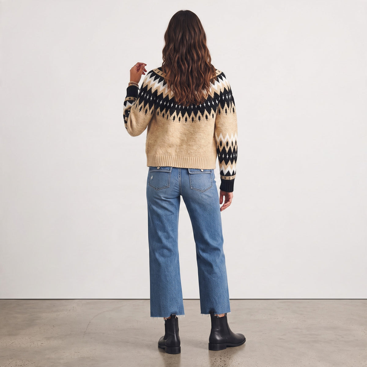 Back view of Apricot Lane Duluth Fair Isle cardigan in taupe, black, and ivory knit with ribbed cuffs and hem.