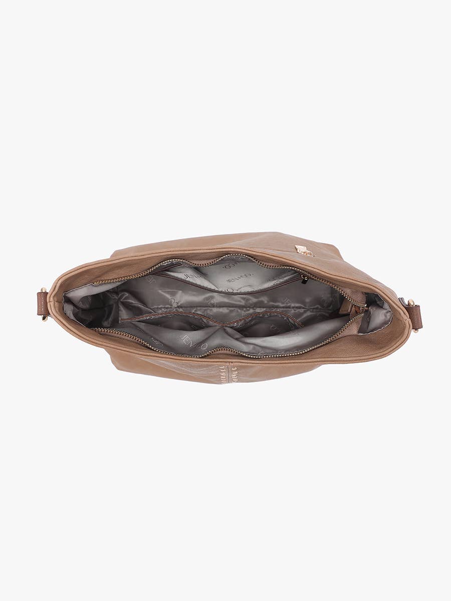 Brown leather bag with open interior on a white background