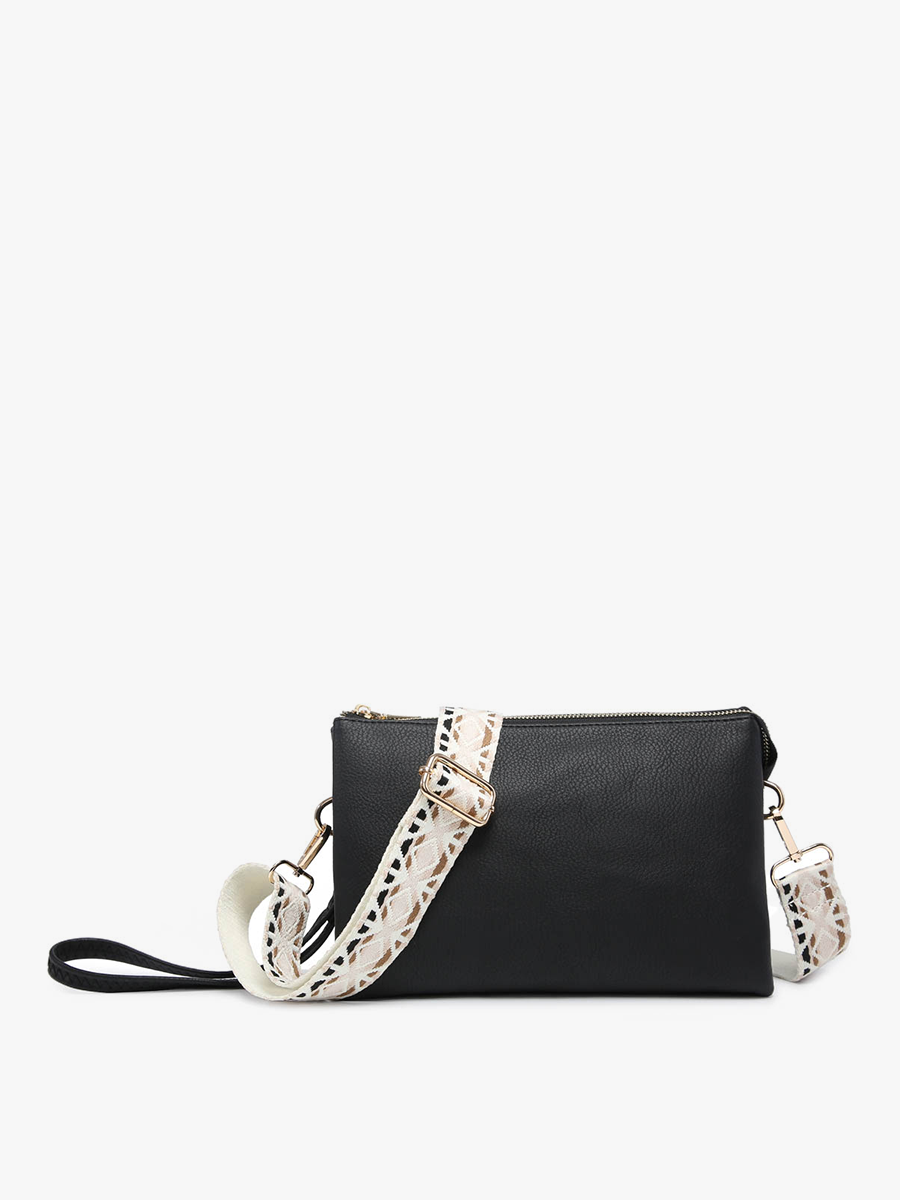 A black leather crossbody clutch bag with a wide, patterned white and black strap featuring gold-tone hardware, shown against a plain white background.