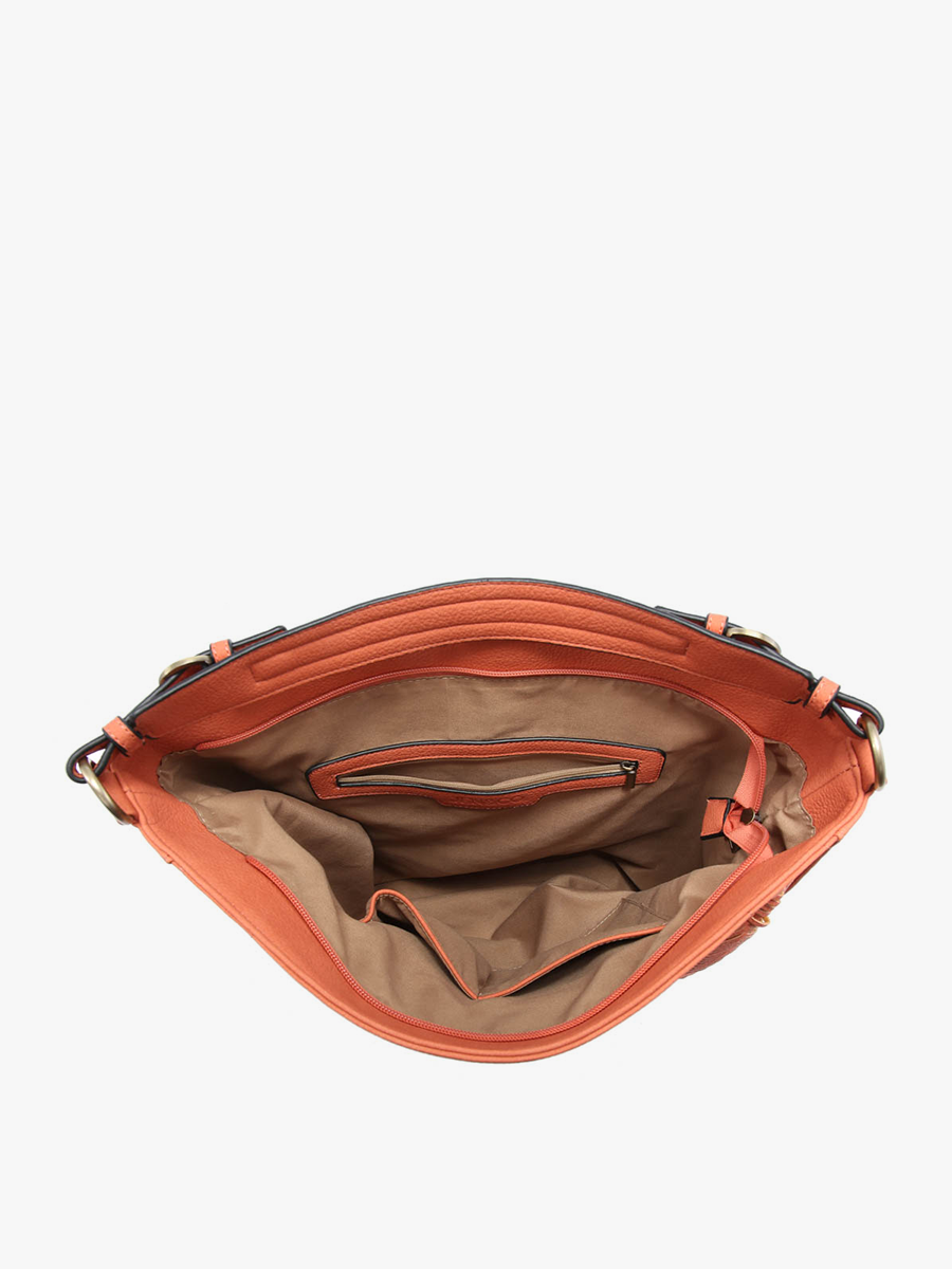 Open orange handbag with visible interior on a white background