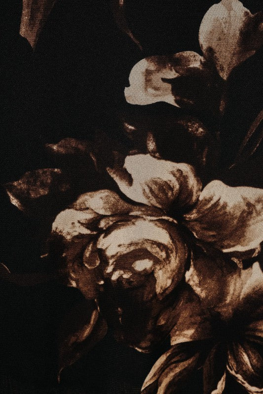 A close-up of a dark floral pattern featuring large peony-like blossoms in warm brown and beige tones against a very dark background.