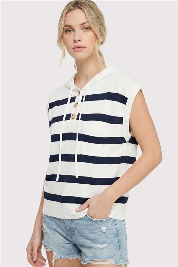 Woman wearing a striped sleeveless hoodie and denim shorts on a white background