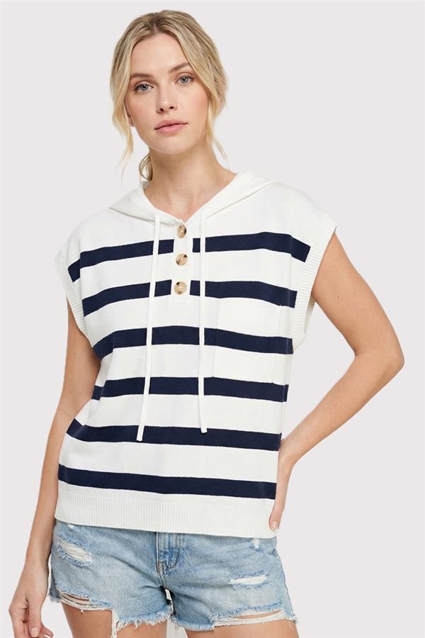 Woman wearing a striped shirt and denim shorts on a white background