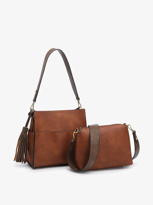 Brown leather handbag with a strap on a white background