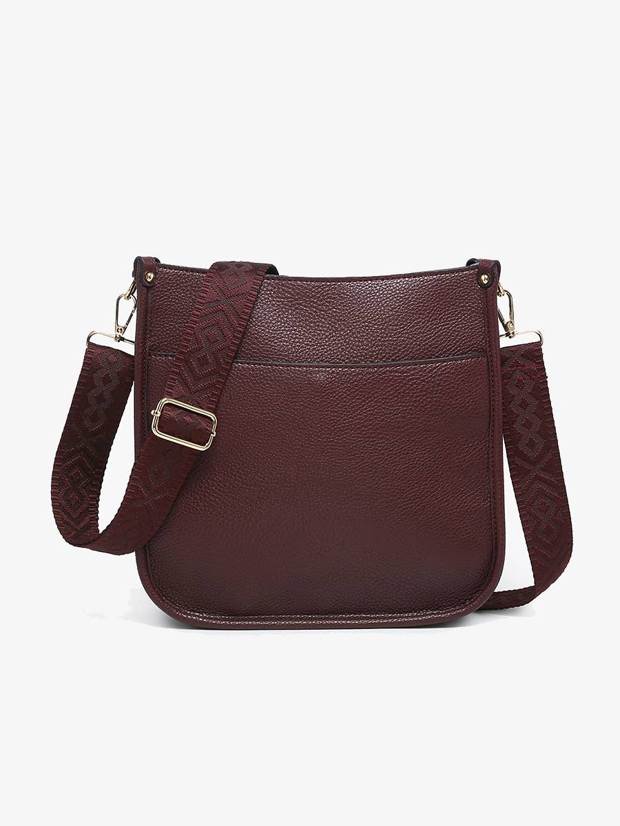 Brown leather crossbody bag on a white background