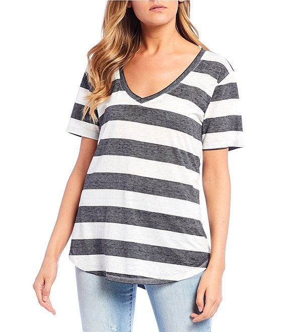 Person wearing a black and white striped t-shirt on a white background