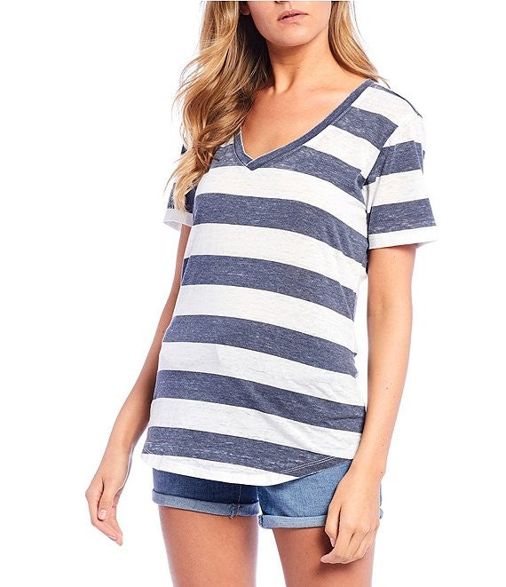 Person wearing a blue 
and white striped t-shirt on a white background