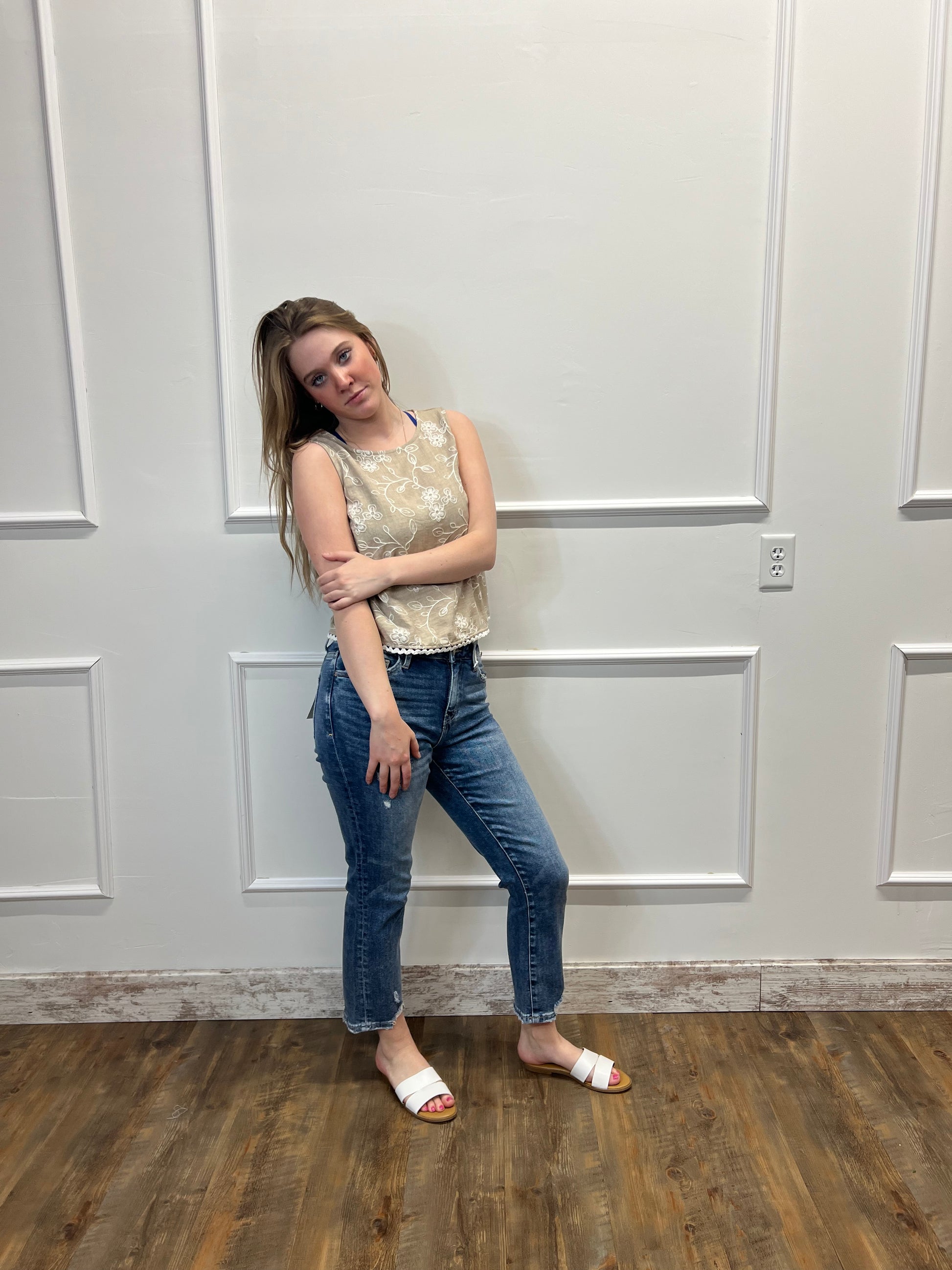 Person lying on a wooden floor with a white door in the background