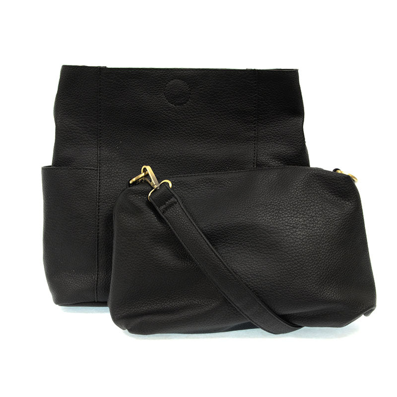 Black leather handbag with a shoulder strap on a white background