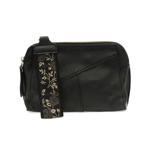 Black leather bag with a floral strap on a white background