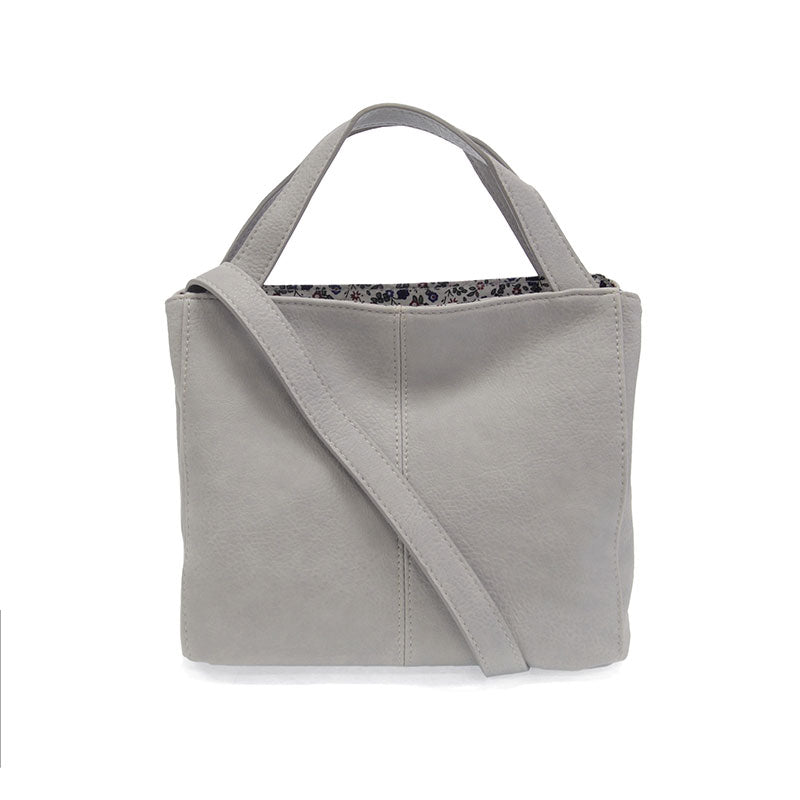 Gray tote bag with a shoulder strap on a white background