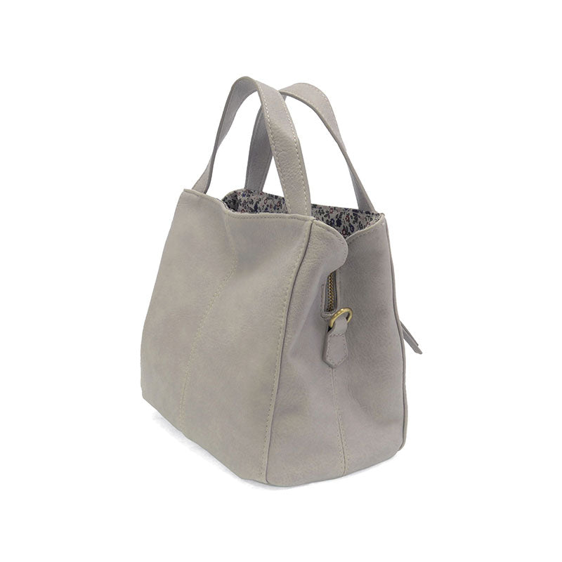 Gray handbag with floral lining on a white background