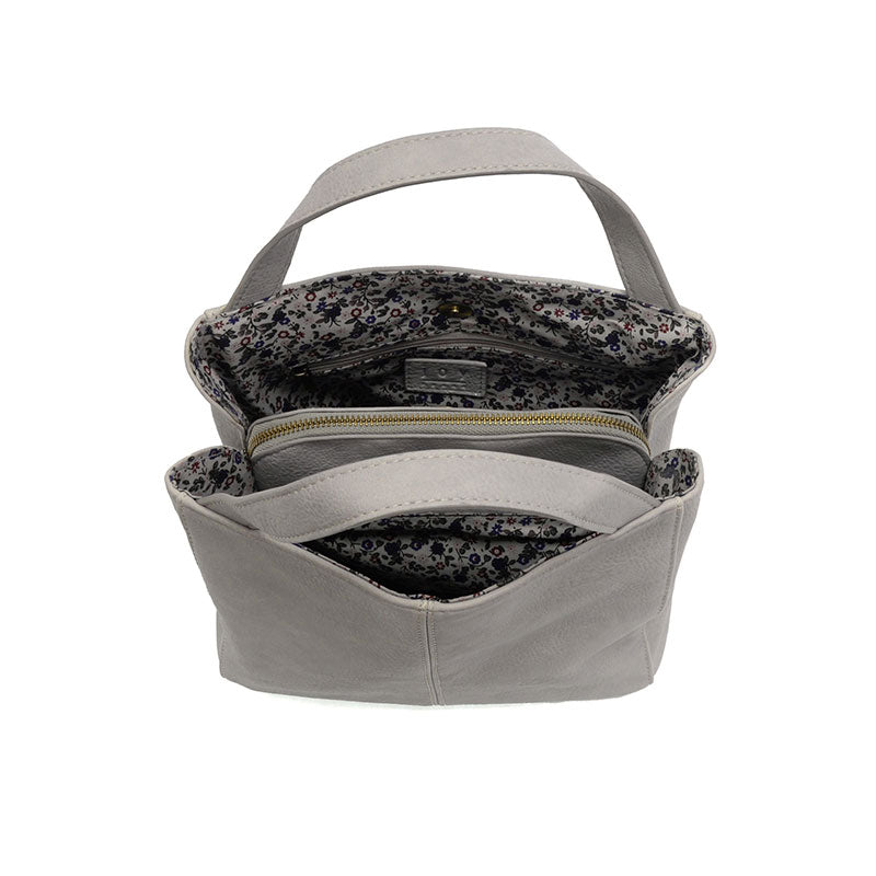 Gray handbag with floral interior lining on a white background