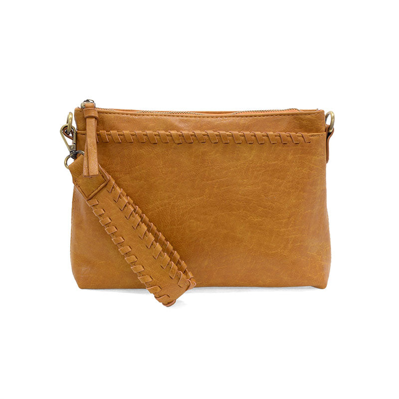 Brown leather crossbody bag with a strap on a white background