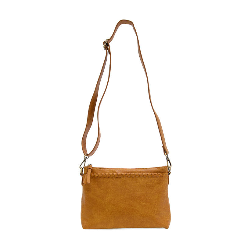 Brown leather crossbody bag on a white background