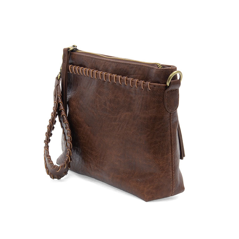 Brown leather handbag with a strap on a white background