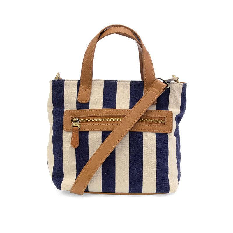 Navy and beige striped handbag with a brown strap on a white background