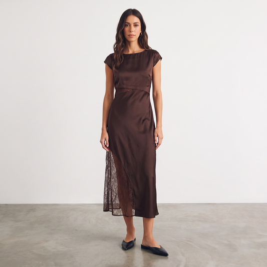 Model wearing Apricot Lane Duluth brown satin midi dress with cap sleeves and sheer lace waist and skirt inserts