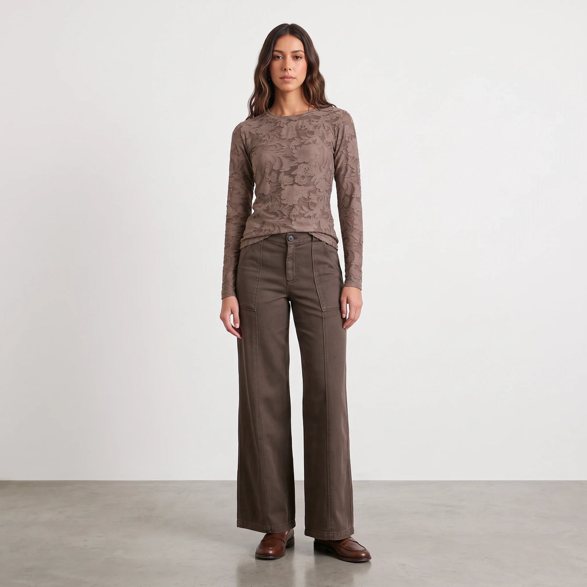 Model wearing Apricot Lane Duluth Camilla Tencel wide-leg pants in brown with a matching long-sleeve lace top.