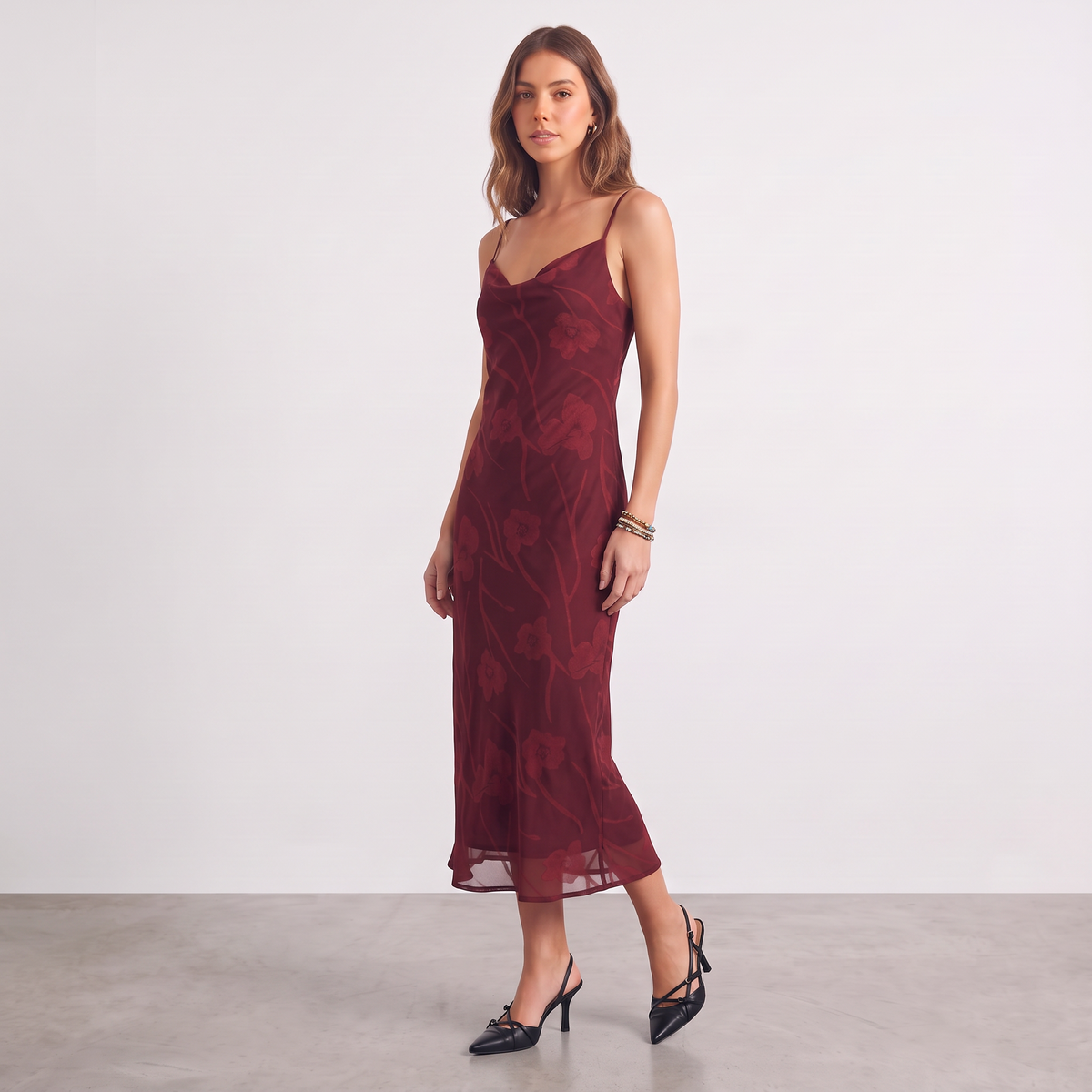 Model wearing Apricot Lane Duluth burgundy floral burnout midi slip dress with cowl neckline and spaghetti straps