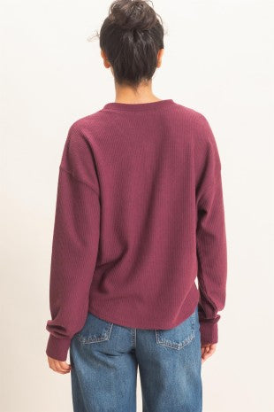 Back view of Apricot Lane Duluth burgundy brushed waffle-knit Henley top with long raglan sleeves.