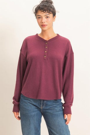 Apricot Lane Duluth burgundy brushed waffle-knit Henley top with long raglan sleeves and button-front neckline.