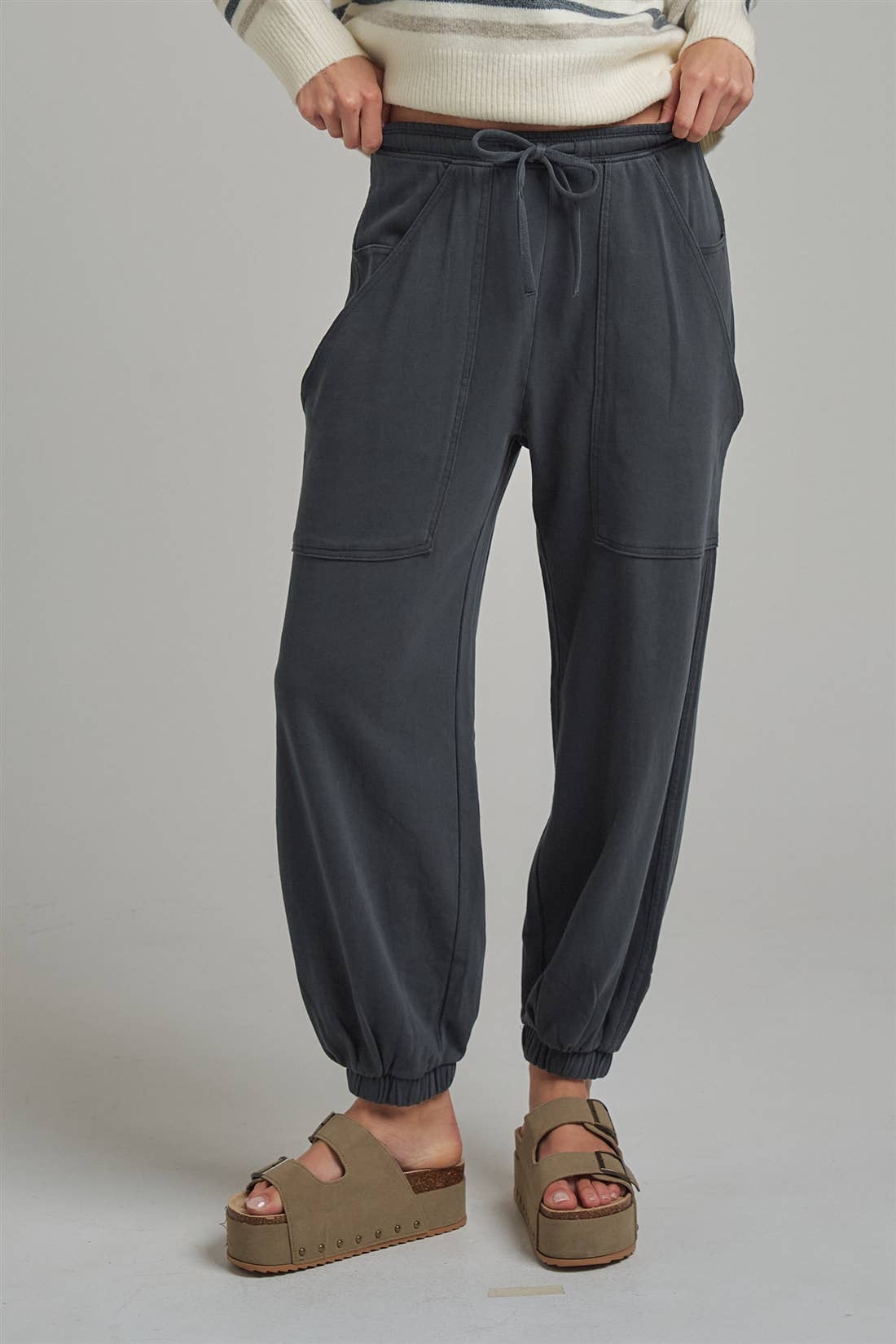 Apricot Lane Duluth Dakota cargo joggers in charcoal grey with an elastic drawstring waist and oversized pockets.