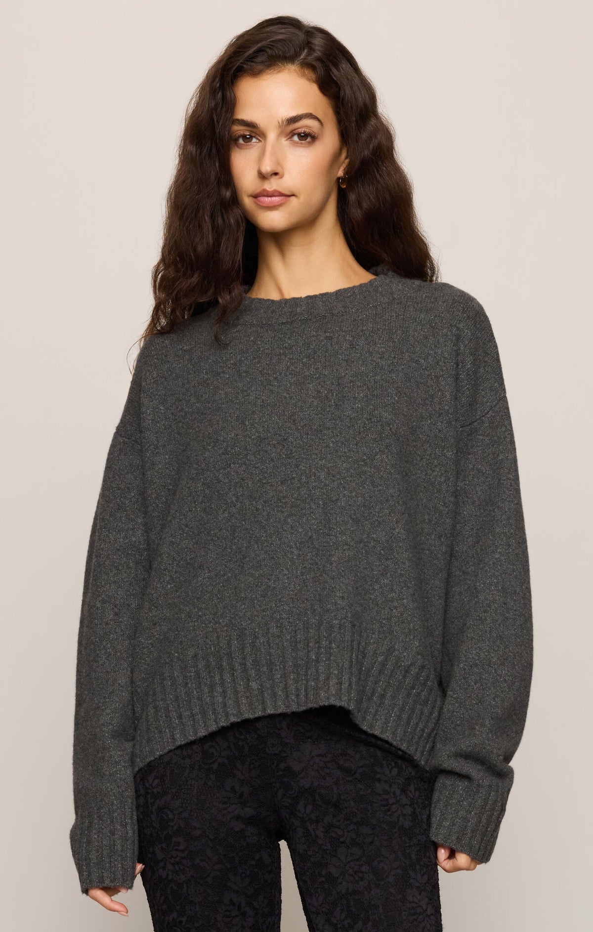 Model wearing Apricot Lane Duluth Easton crew neck pullover sweater in charcoal grey soft cozy yarn