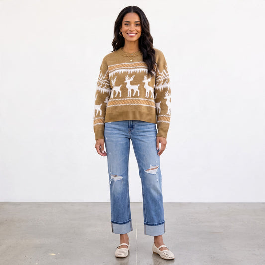 Apricot Lane Duluth chestnut brown knit sweater with ivory reindeer pattern and Fair Isle details on a woman.