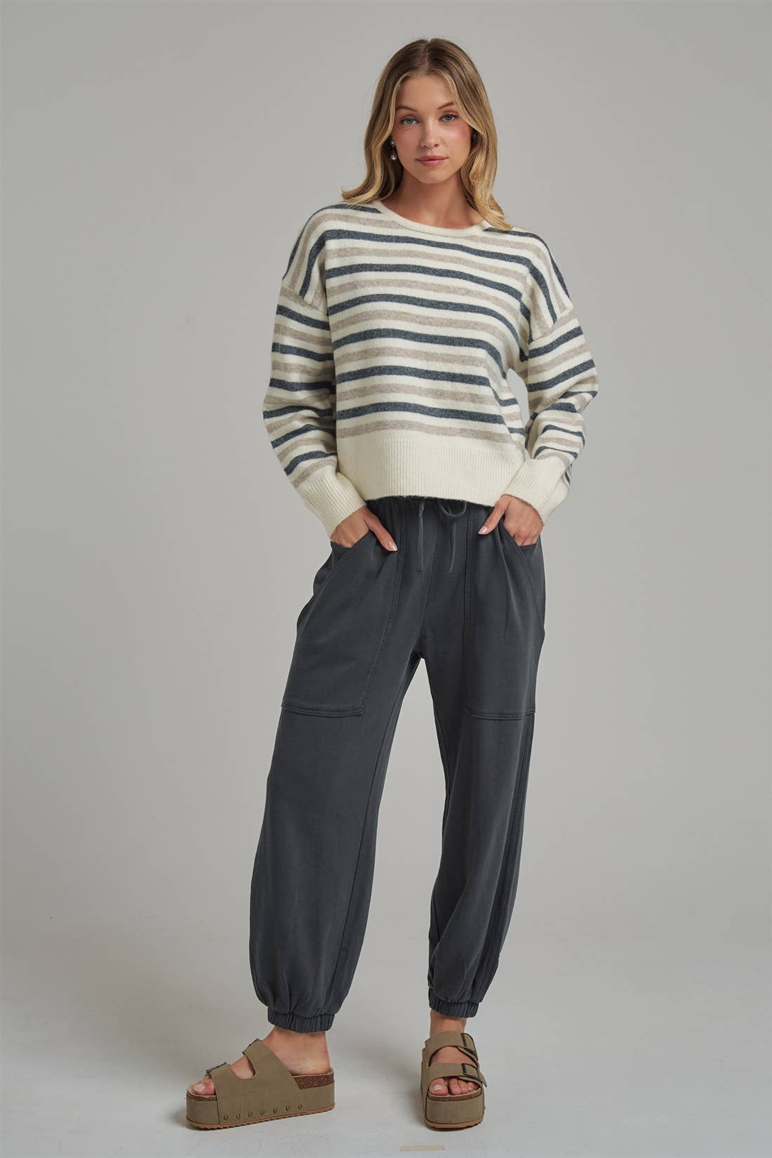 Apricot Lane Duluth Dakota cargo joggers in charcoal grey with elastic drawstring waist paired with striped sweater
