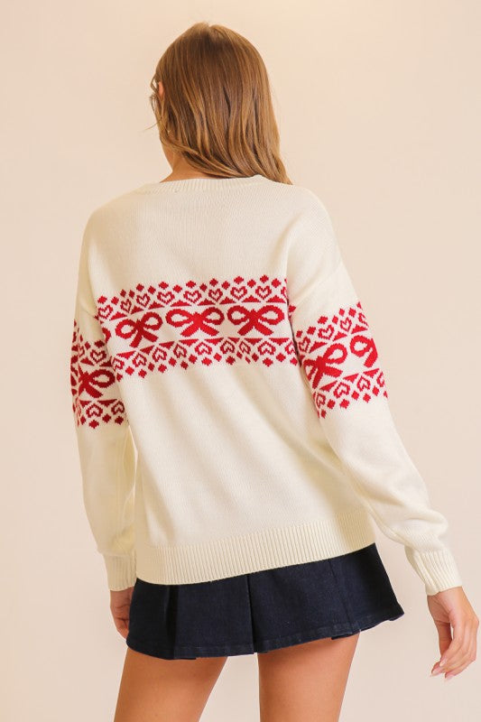 Apricot Lane Duluth cream sweater with red Fair Isle pattern featuring bow and heart motifs, back view