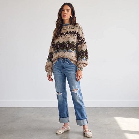 Model wearing Apricot Lane Duluth Aspen Fair Isle mock neck sweater with blue distressed jeans and beige flats