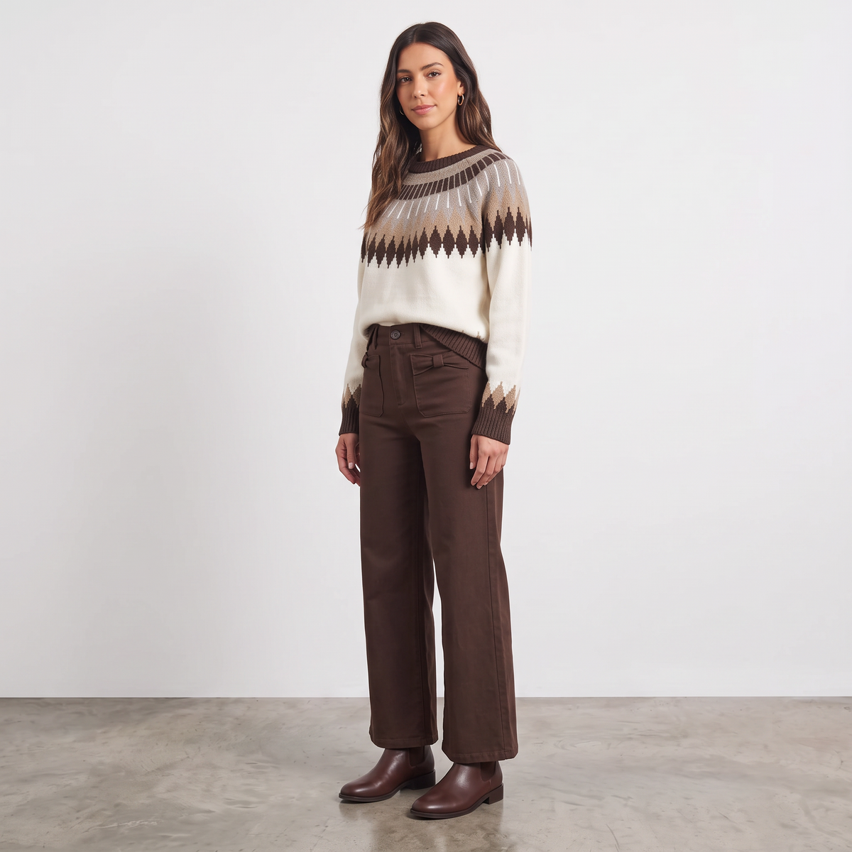 Model wearing Apricot Lane Duluth Brynn Fair Isle yoke sweater with geometric pattern and brown trousers