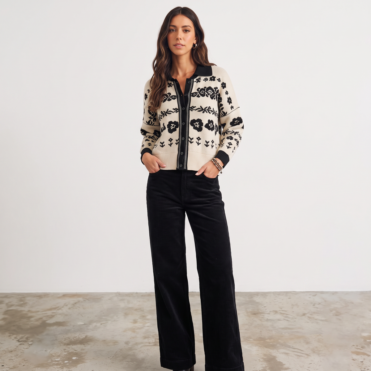 Model wearing an Apricot Lane Duluth beige and black floral jacquard cardigan with long sleeves and button front