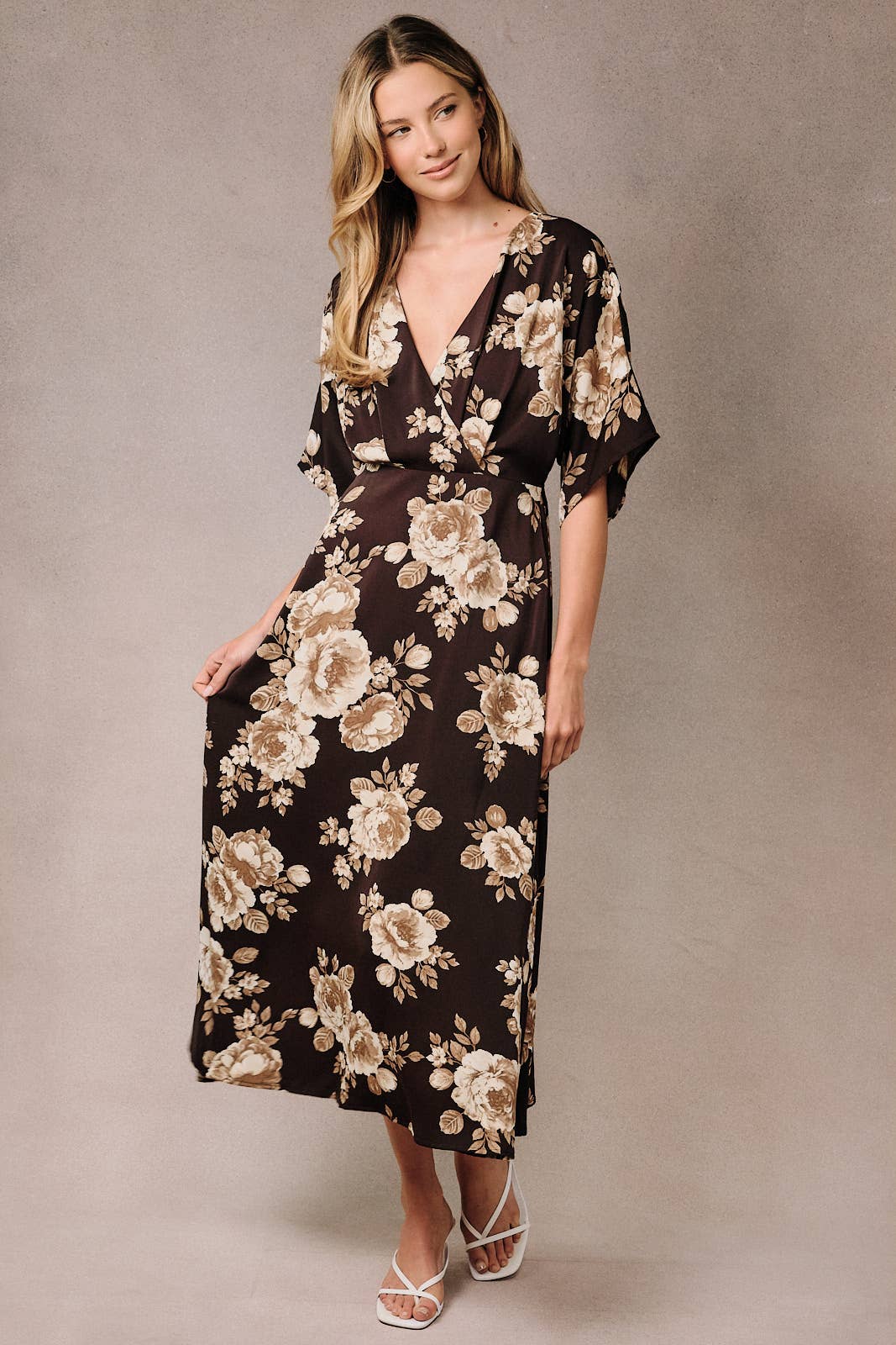 Model wearing an Apricot Lane Duluth floral midi dress with kimono sleeves, surplice neckline, and elasticized waist.