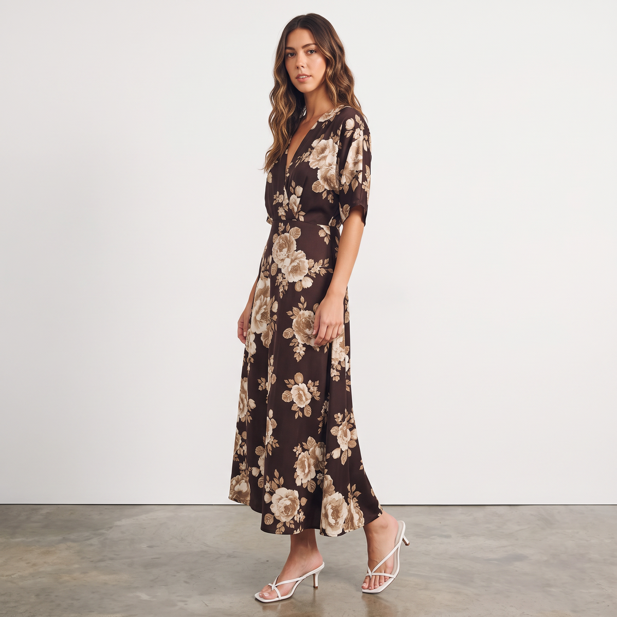 Model wearing an Apricot Lane Duluth brown floral midi dress with kimono sleeves and a surplice neckline.