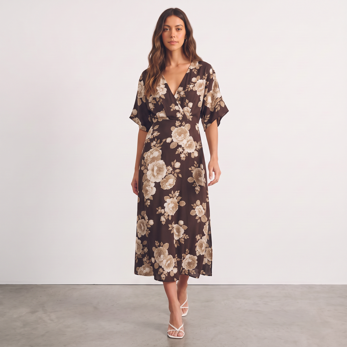 Model wearing an Apricot Lane Duluth brown floral midi dress with kimono sleeves and a surplice V-neckline.