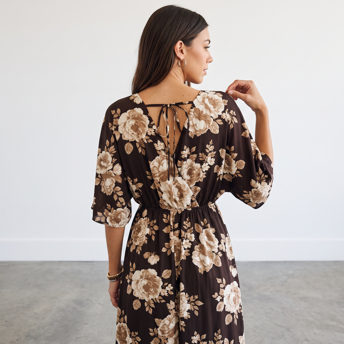 Back view of Apricot Lane Duluth floral midi dress with kimono sleeves, elastic waist, and tie-back keyhole detail.