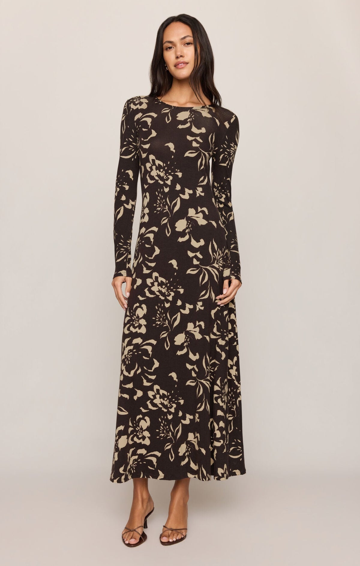 Model wearing Apricot Lane Duluth Lilian Freya floral midi dress in black stretch jersey with a boat neckline.