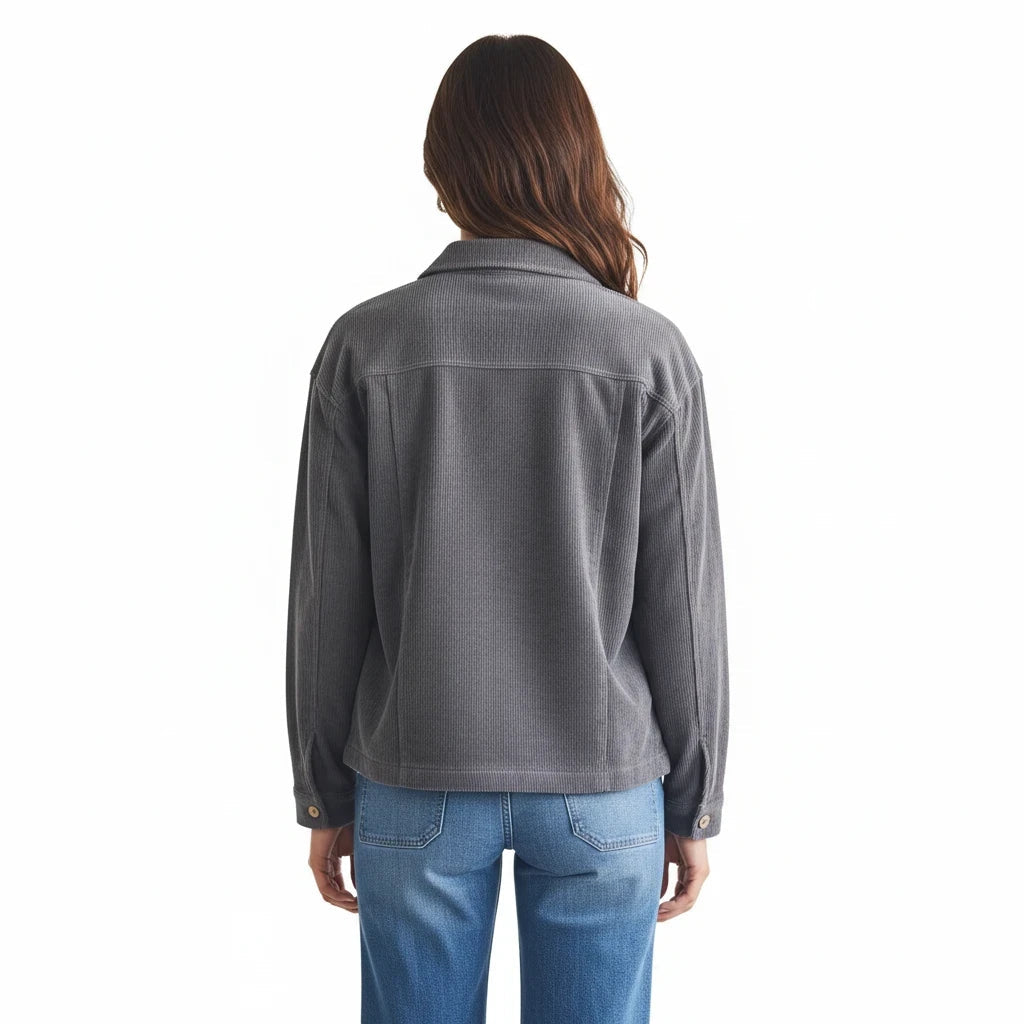 Back view of a woman wearing the Apricot Lane Duluth Hadley oversized grey corduroy shacket with blue jeans