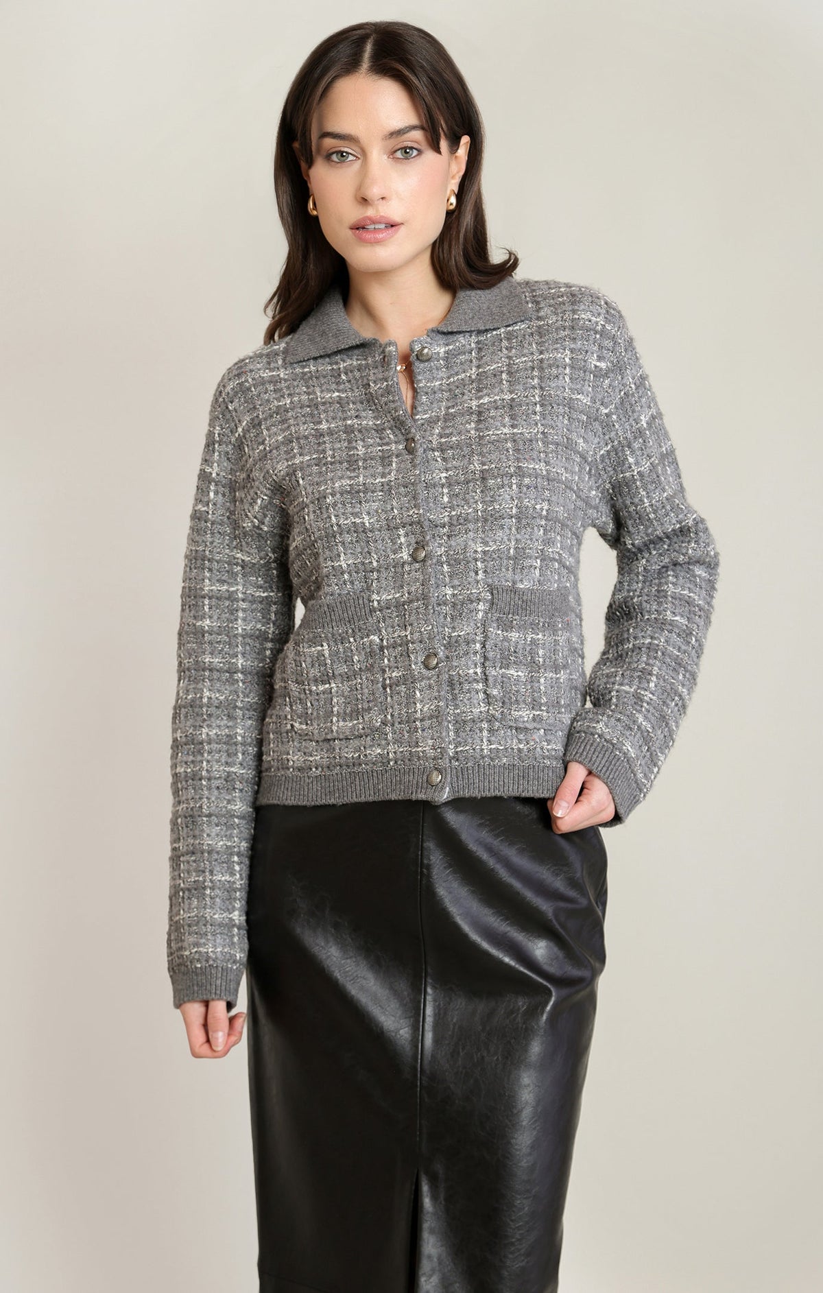 Model wearing Apricot Lane Duluth grey tweed-inspired knit cardigan with a collar and button-front closure.