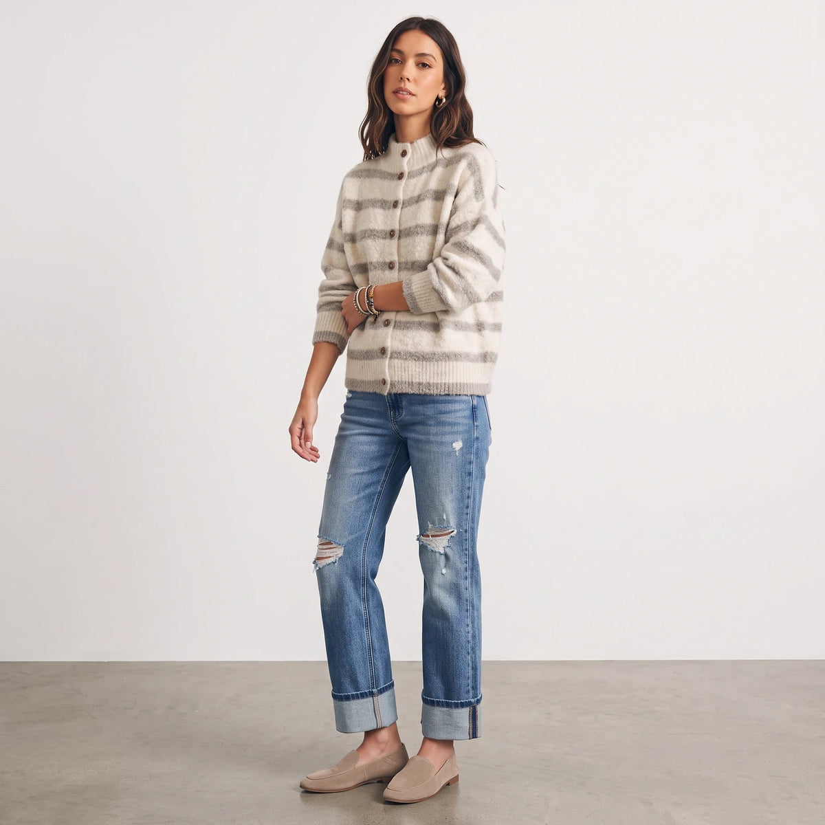 Model wearing Apricot Lane Duluth Lila stripe fuzzy knit cardigan with mock neck and button front over ripped jeans