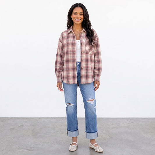 Apricot Lane Duluth Maren plaid button-down shirt worn open over a white top with distressed blue jeans