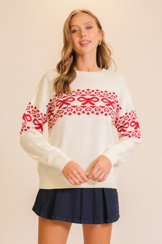 Apricot Lane Duluth Noelle sweater in cream with red Fair Isle bow and heart pattern, crew neck, long sleeve pullover
