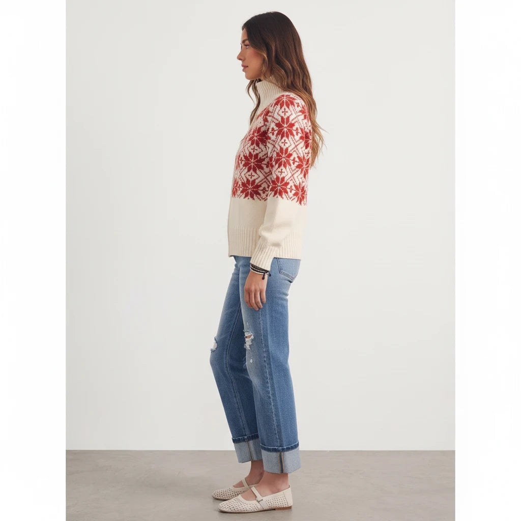 Model wearing Apricot Lane Duluth Nordic Snowflake Fair Isle zip cardigan with red pattern and cream knit base
